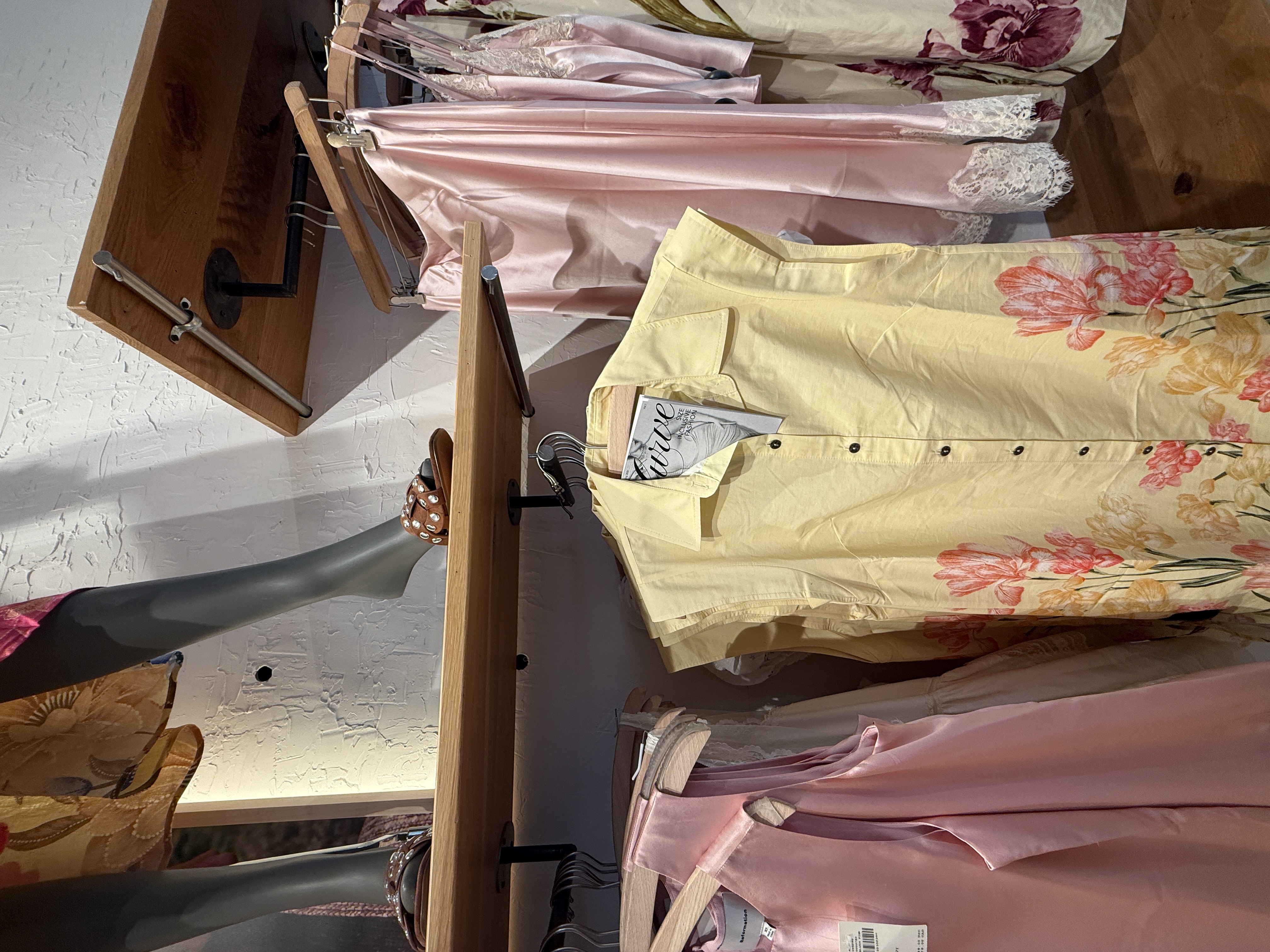 Zine placed in top of dress hanging up in anthropologie